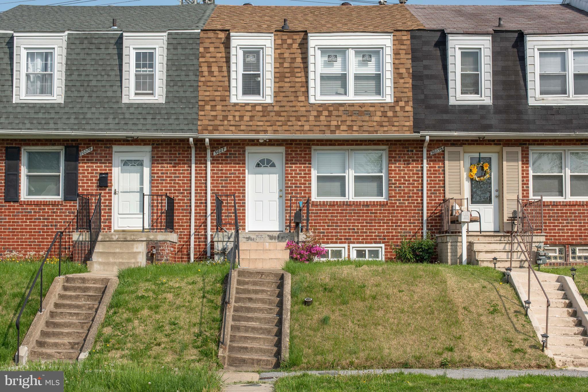 5607 Whitby Road Baltimore, MD 21206 - Photo 2 of 20 a front view of a house with a yard