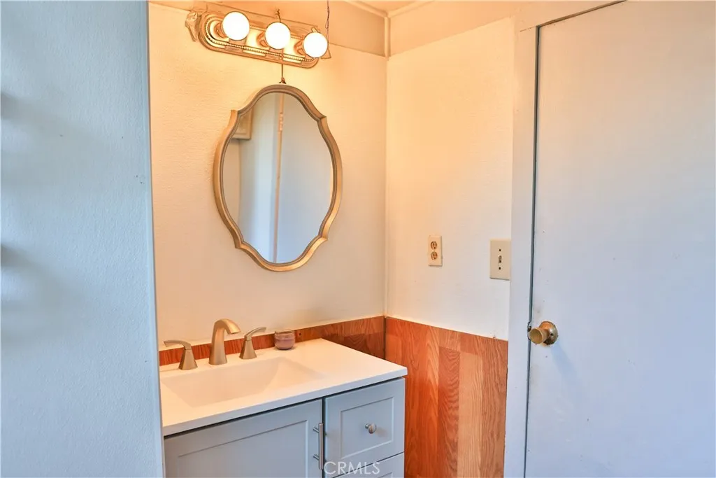 10825 Paskenta Road Red Bluff, CA 96080 - Photo 14 of 42 a bathroom with a sink and a mirror