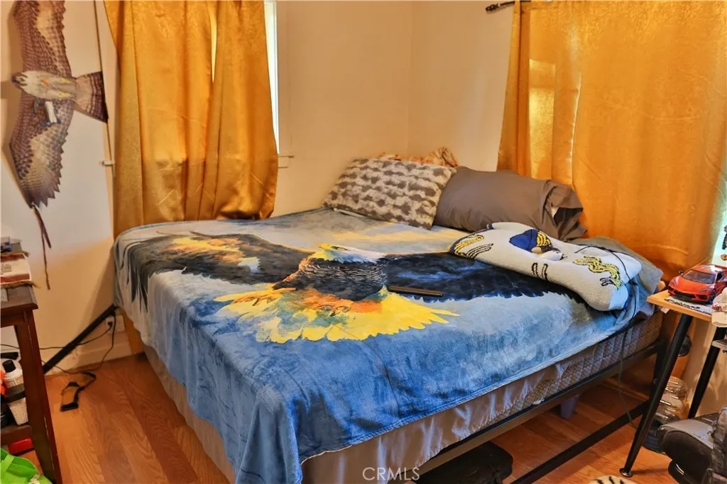 10825 Paskenta Road Red Bluff, CA 96080 - Photo 20 of 42 a bed sitting in a bedroom next to a window