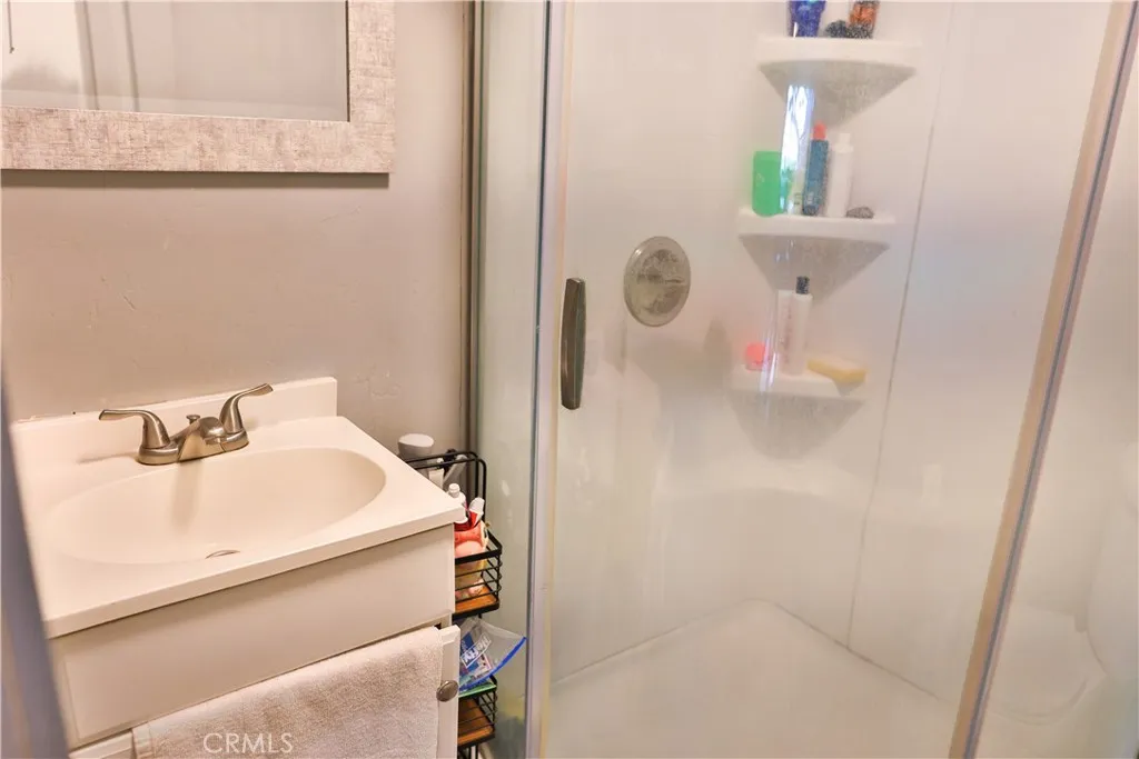 10825 Paskenta Road Red Bluff, CA 96080 - Photo 21 of 42 a bathroom with a sink and mirror