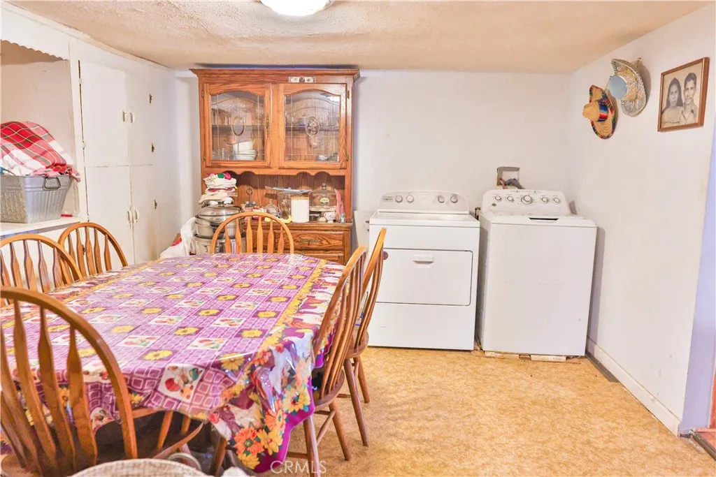 10825 Paskenta Road Red Bluff, CA 96080 - Photo 22 of 42 a bedroom with a bed and a table