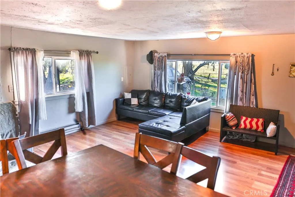 10825 Paskenta Road Red Bluff, CA 96080 - Photo 25 of 42 a living room with furniture rug and a large window