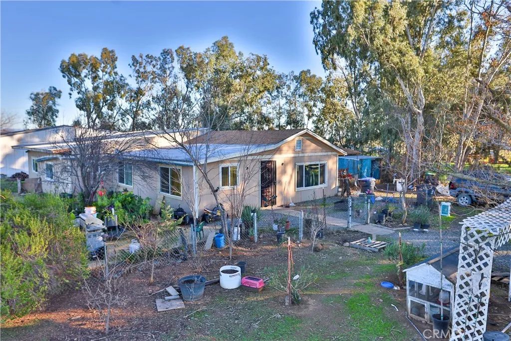 10825 Paskenta Road Red Bluff, CA 96080 - Photo 3 of 42 a house view with a sitting space and garden space