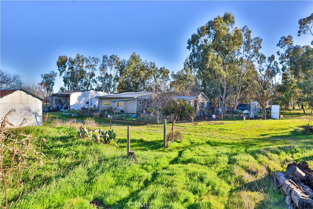 10825 Paskenta Road Red Bluff, CA 96080 - Photo 35 of 42 a view of a swimming pool with a yard