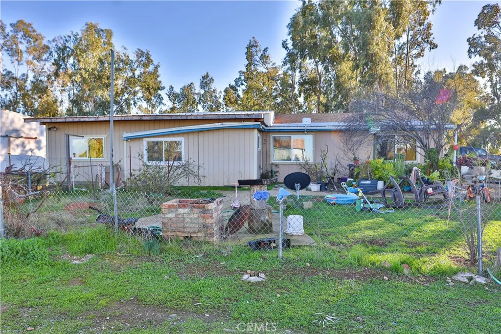 10825 Paskenta Road Red Bluff, CA 96080 - Photo 36 of 42 a view of backyard of house with outdoor seating and green space