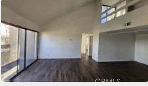 1400 West Edgehill Road, Unit 24 San Bernardino, CA 92405 - Photo 1 of 1 a view of an empty room with wooden floor and a window