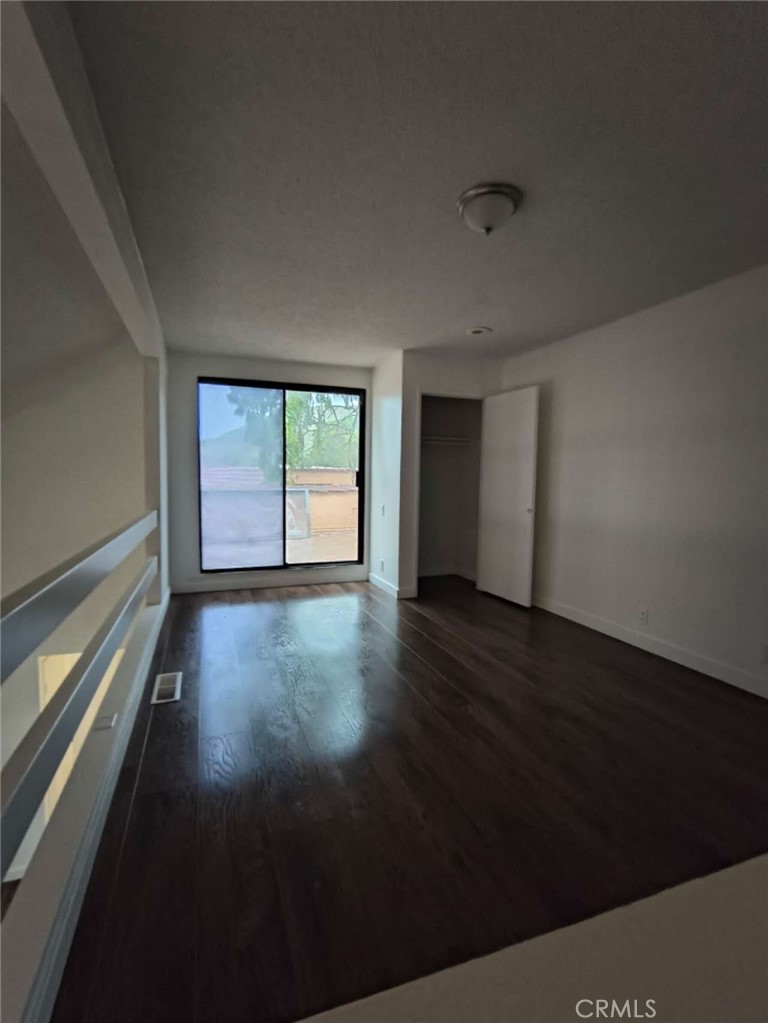 1400 West Edgehill Road, Unit 24 San Bernardino, CA 92405 - Photo 2 of 6 a view of an empty room with a window
