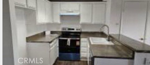 1400 West Edgehill Road, Unit 24 San Bernardino, CA 92405 - Photo 3 of 6 a kitchen with granite countertop a sink and a stove