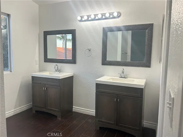 a white toilet sitting next to a shower