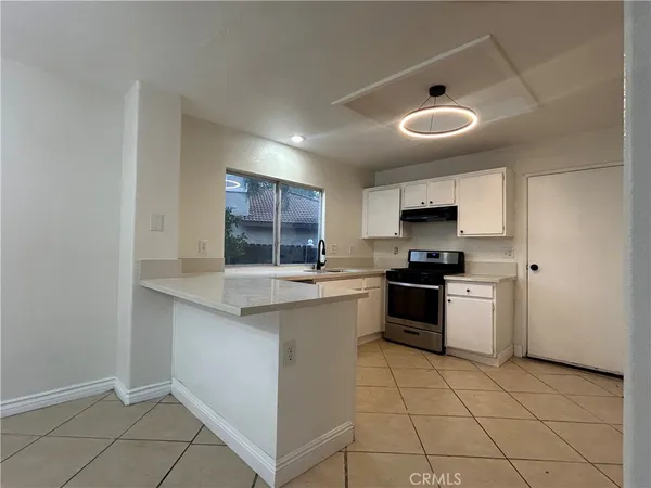 a view of storage and utility room with washer and dryer