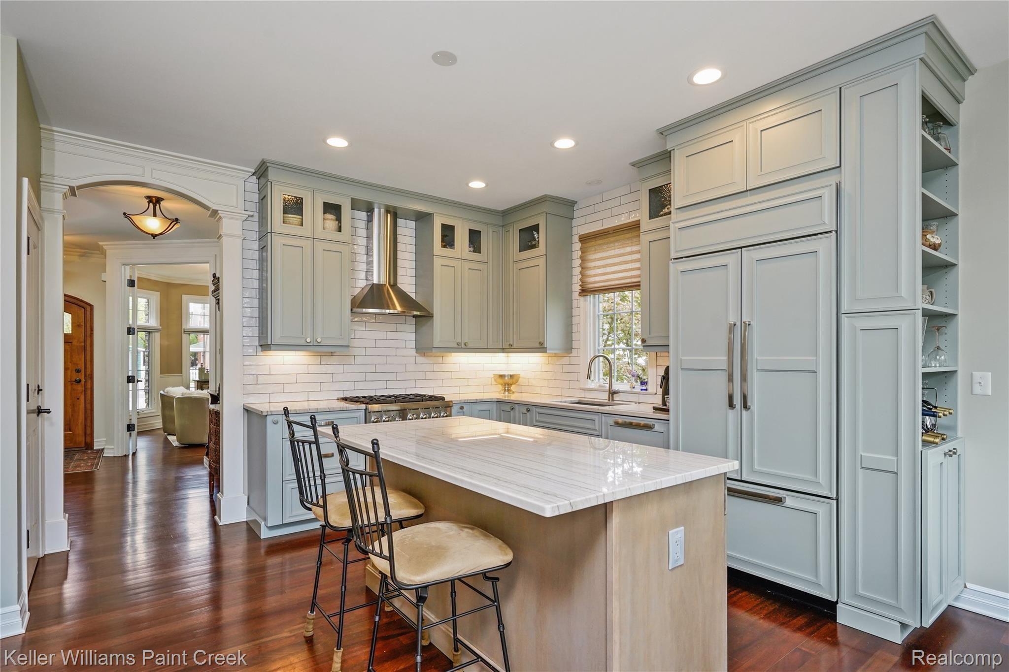 309 West 2nd Street Rochester, MI 48307 - Photo 3 of 19 Remodeled kitchen features integrated appliances, ceiling to floor cabinets, and updated designer decor.