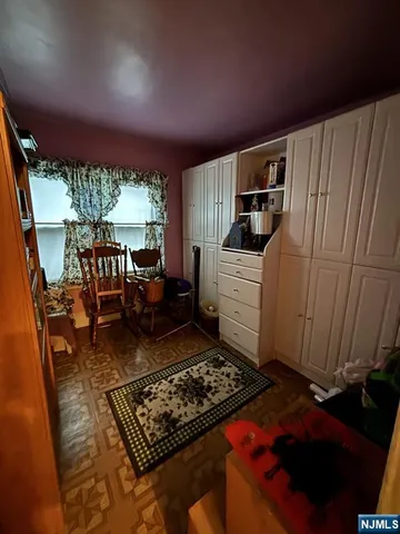 a room with furniture and a rug