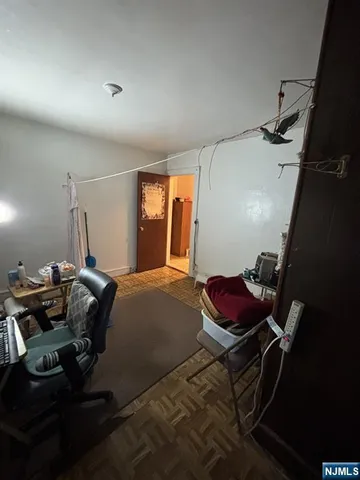 a bedroom with a bed and gym equipment