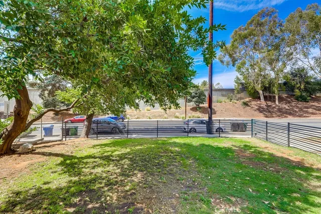 a view of a house with a yard porch and sitting area