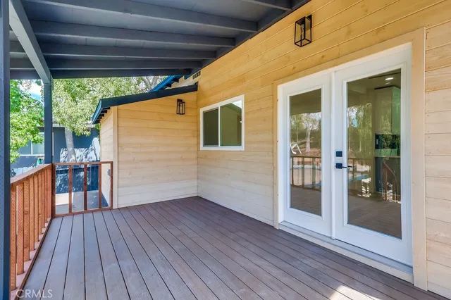 a view of a porch with wooden floor