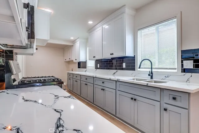 a kitchen with a sink and cabinets