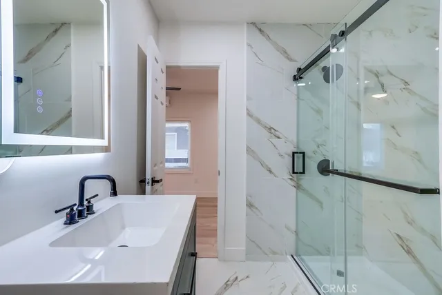 a bathroom with a sink and mirror