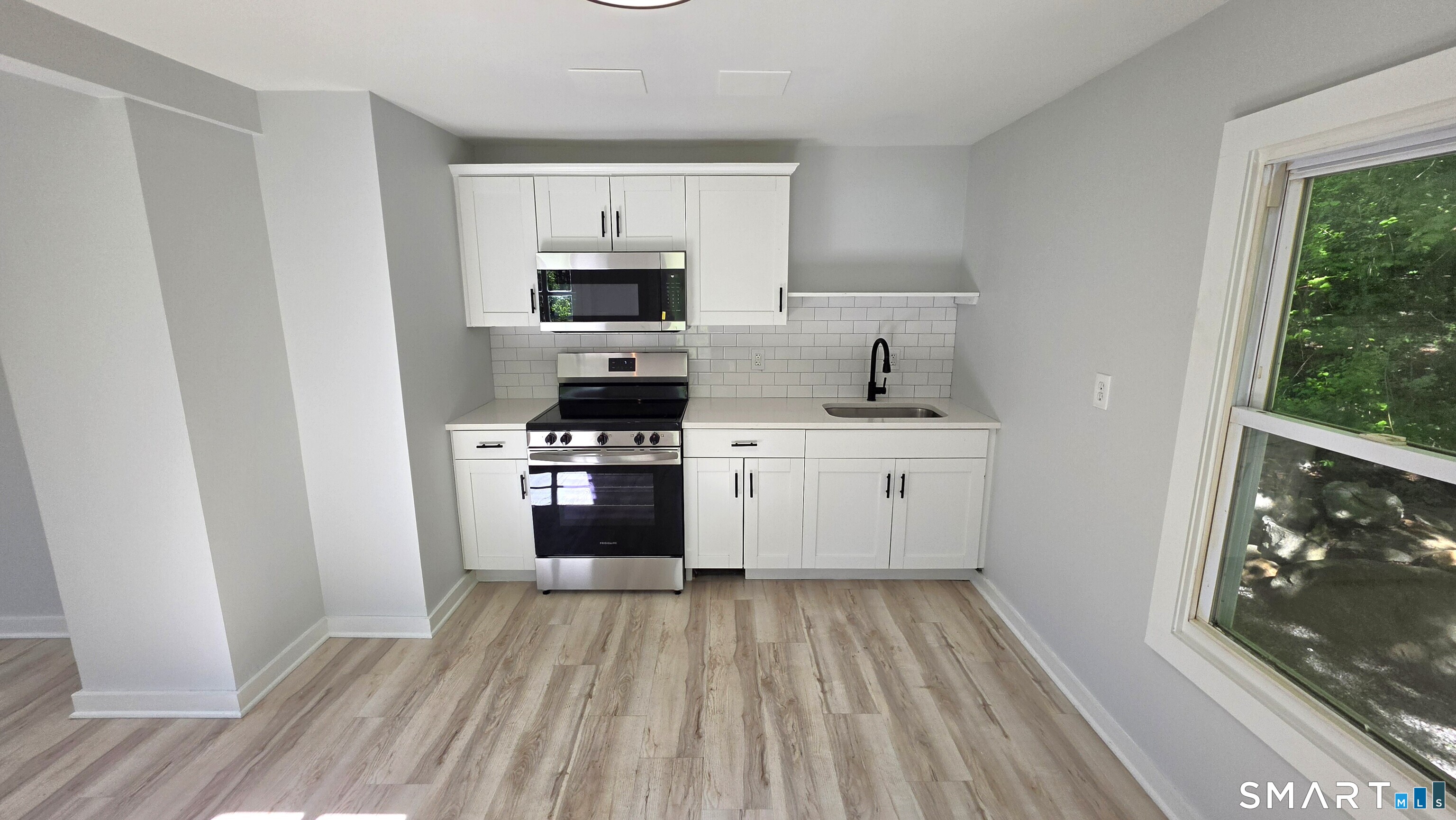 2 Maria Hotchkiss Road Prospect, CT 06712 - Photo 12 of 17 a kitchen with a sink a stove top oven and wooden floor