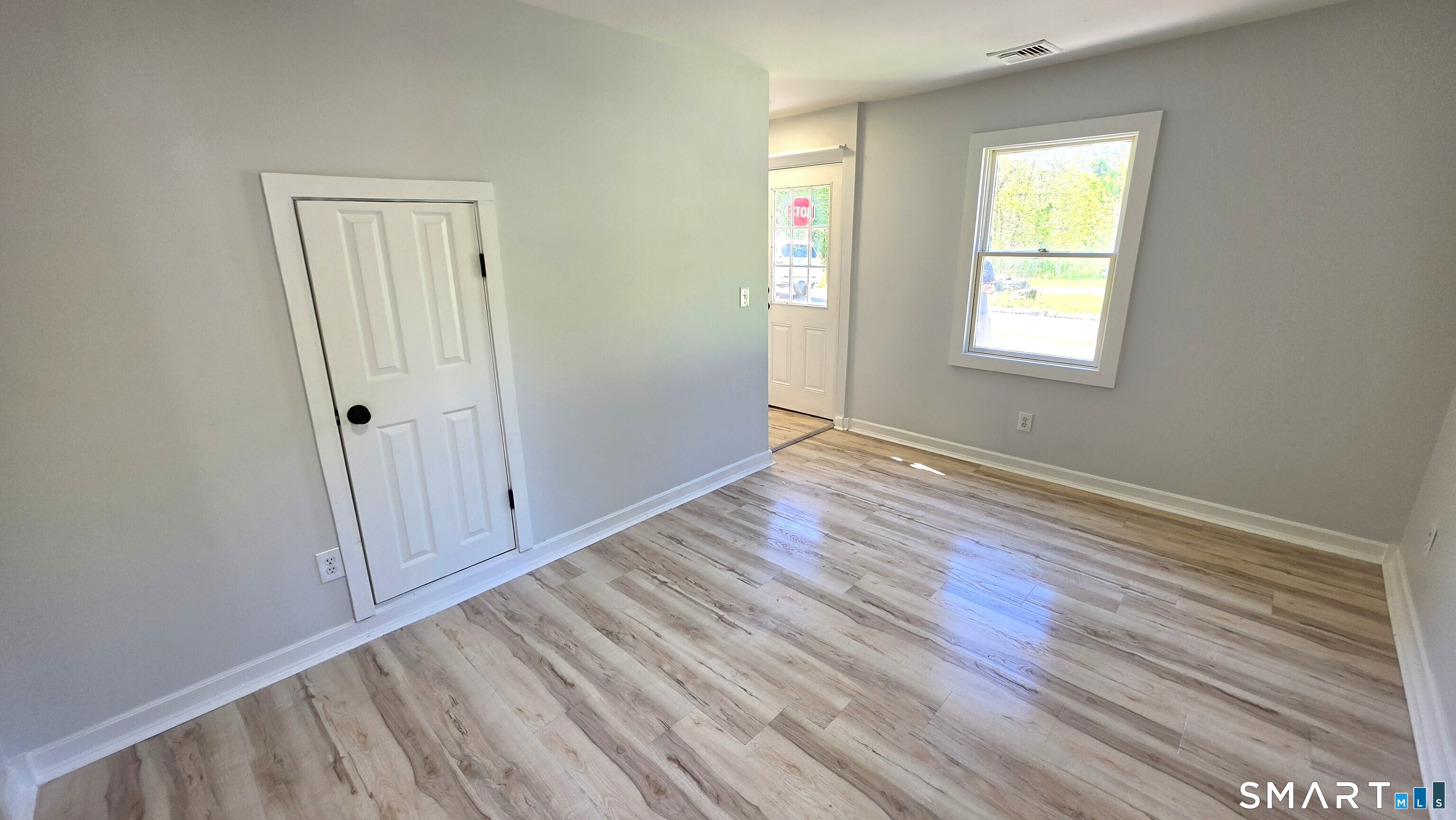 2 Maria Hotchkiss Road Prospect, CT 06712 - Photo 6 of 17 a view of an empty room with wooden floor and a window