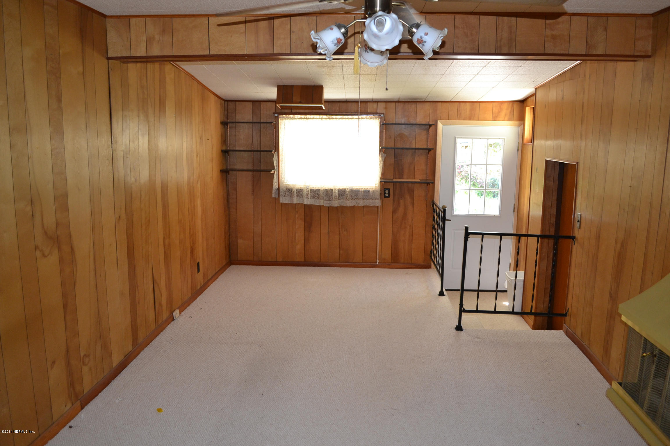 1772 Planters Road Jacksonville, FL 32207 - Photo 3 of 13 a view of a garage with wooden floor and windows