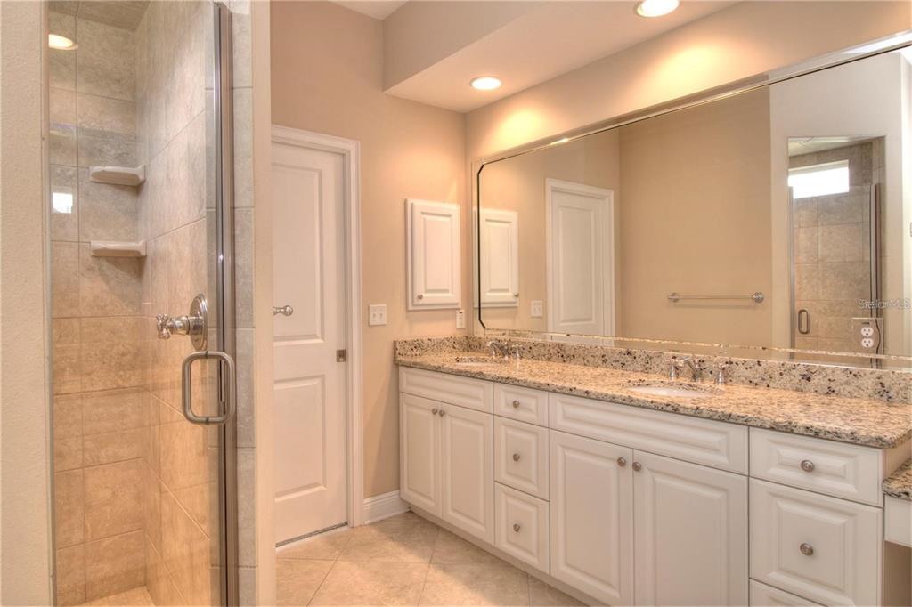 1922 Southeast 29th Street Ocala, FL 34471 - Photo 14 of 29 a bathroom with a granite countertop sink mirror and double