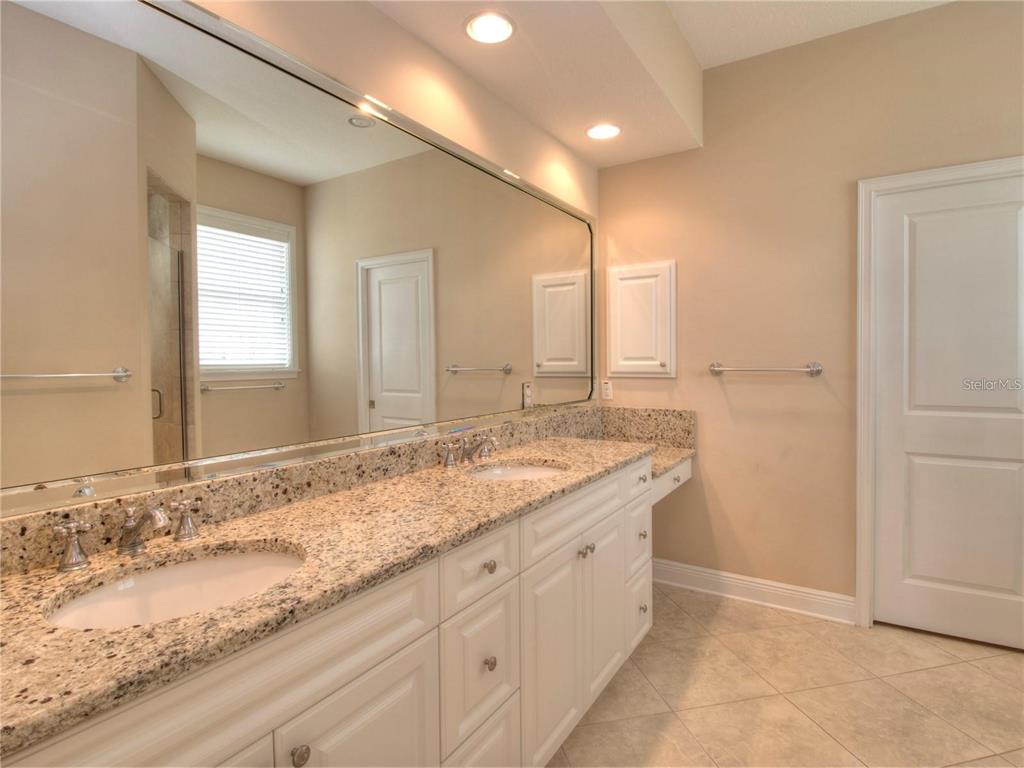 1922 Southeast 29th Street Ocala, FL 34471 - Photo 15 of 29 a bathroom with a granite countertop sink and a mirror
