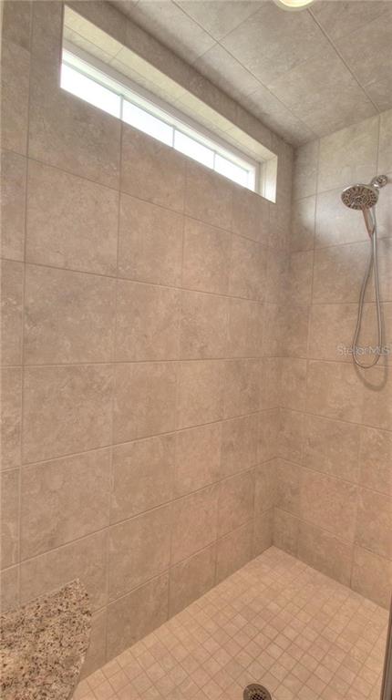 1922 Southeast 29th Street Ocala, FL 34471 - Photo 16 of 29 a bathroom with a shower