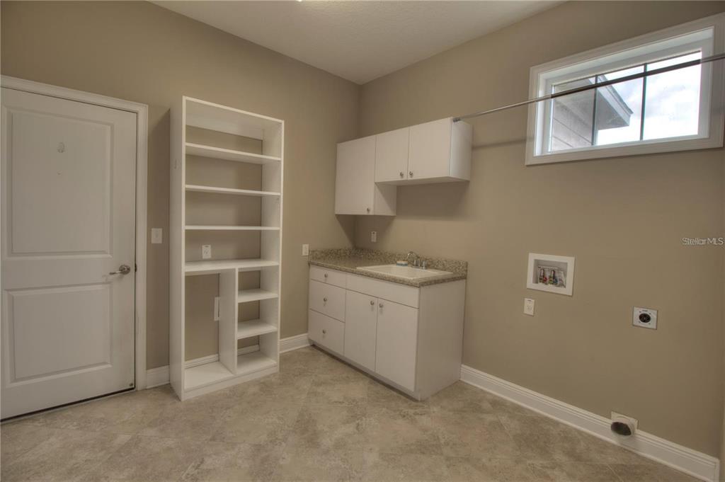 1922 Southeast 29th Street Ocala, FL 34471 - Photo 25 of 29 a room with a cabinets and window