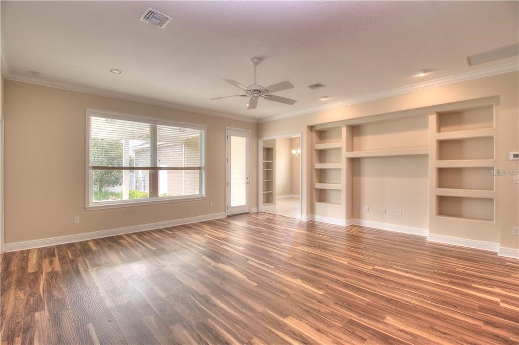 1922 Southeast 29th Street Ocala, FL 34471 - Photo 5 of 29 a view of an empty room with a window and wooden floor