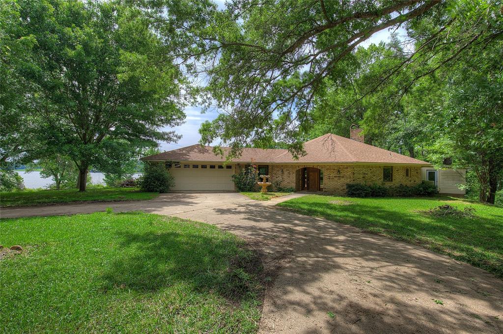 1920 County Rd SE 3370 Winnsboro, TX 75494 - Photo 1 of 40 a view of a house with backyard and sitting area