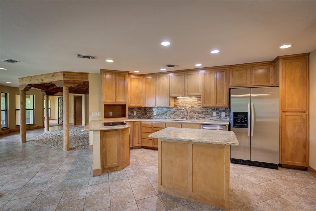 1920 County Rd SE 3370 Winnsboro, TX 75494 - Photo 11 of 40 a kitchen with a refrigerator and a sink