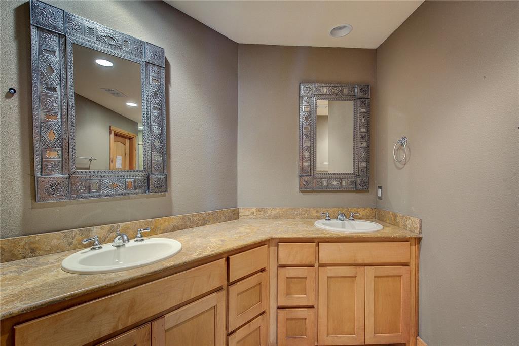 1920 County Rd SE 3370 Winnsboro, TX 75494 - Photo 18 of 40 a bathroom with a granite countertop sink and a mirror