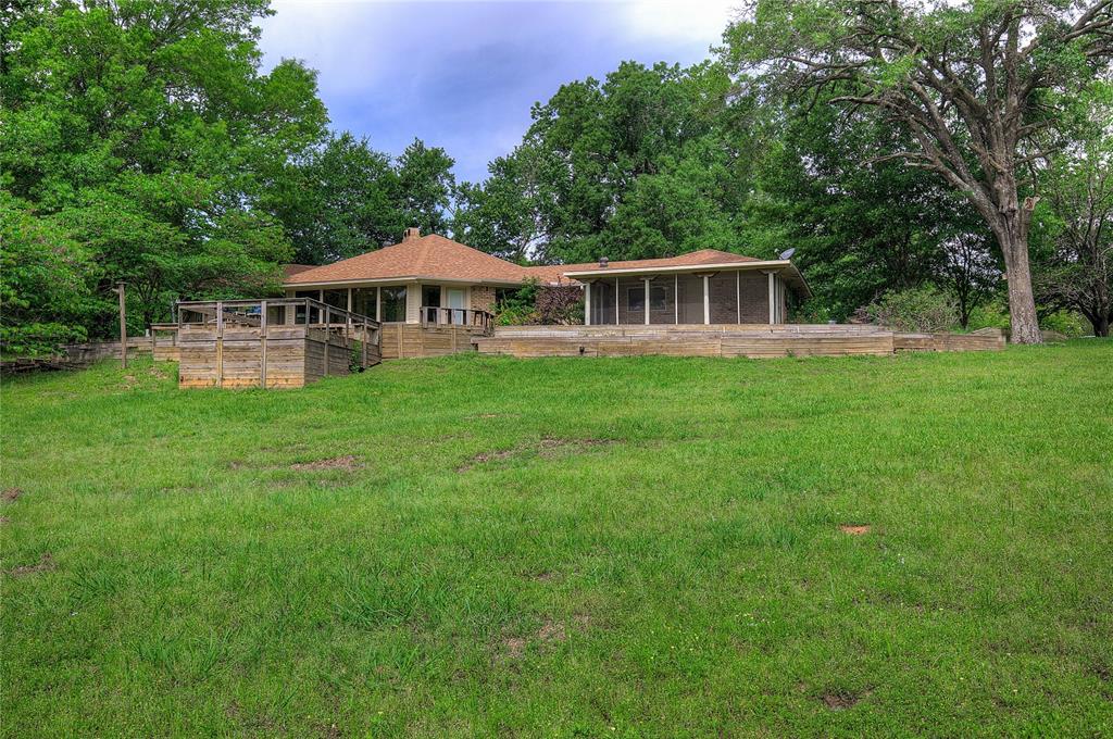 1920 County Rd SE 3370 Winnsboro, TX 75494 - Photo 31 of 40 a view of a house with a yard