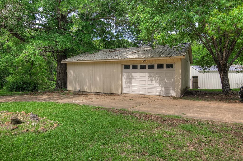 1920 County Rd SE 3370 Winnsboro, TX 75494 - Photo 34 of 40 a view of a backyard with a large tree