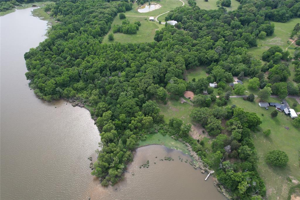 1920 County Rd SE 3370 Winnsboro, TX 75494 - Photo 40 of 40 an aerial view of a house with a yard and street