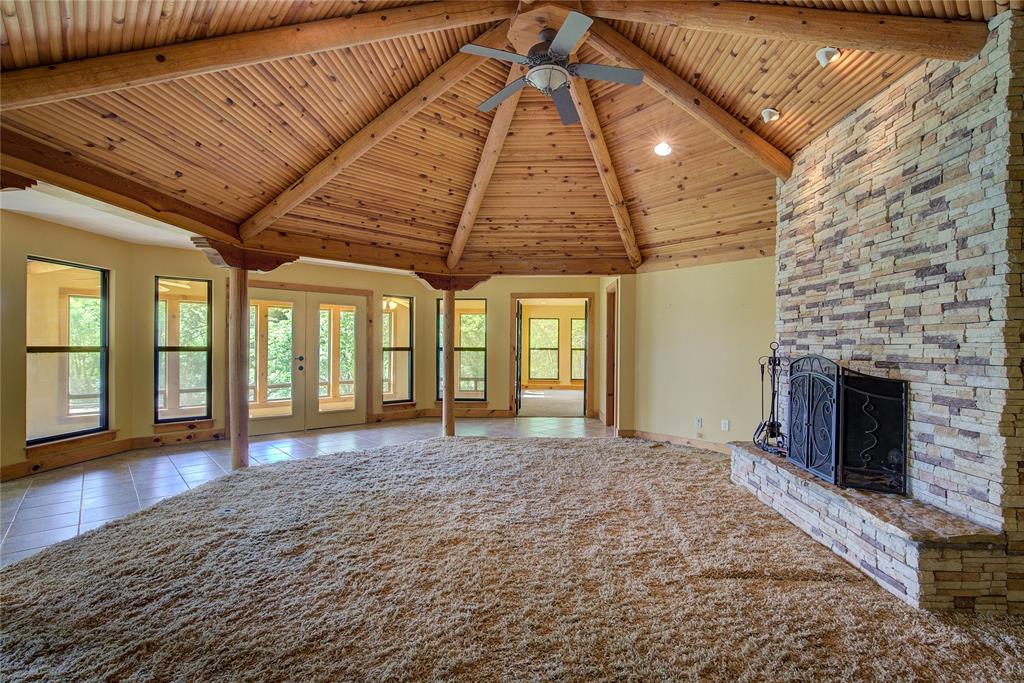 1920 County Rd SE 3370 Winnsboro, TX 75494 - Photo 4 of 40 a view of empty room with wooden floor and fireplace