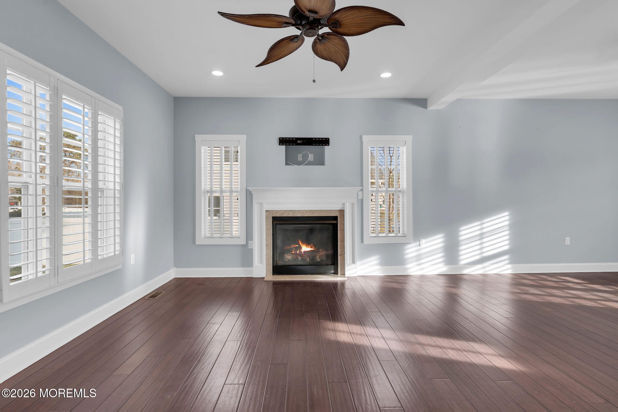 4 Conor Court Bayville, NJ 08721 - Photo 20 of 45 a view of an empty room with wooden floor fireplace and a window
