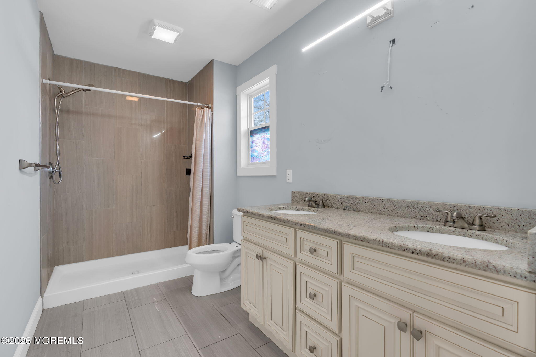 4 Conor Court Bayville, NJ 08721 - Photo 25 of 45 a spacious bathroom with a granite countertop sink a toilet and a shower