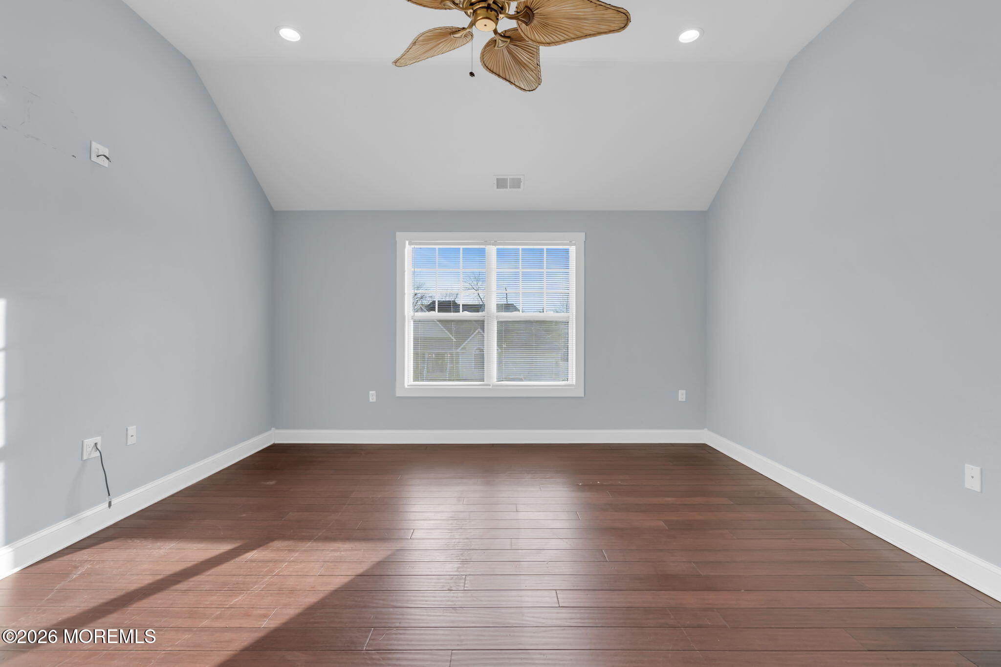 4 Conor Court Bayville, NJ 08721 - Photo 27 of 45 a view of an empty room with a window and wooden floor