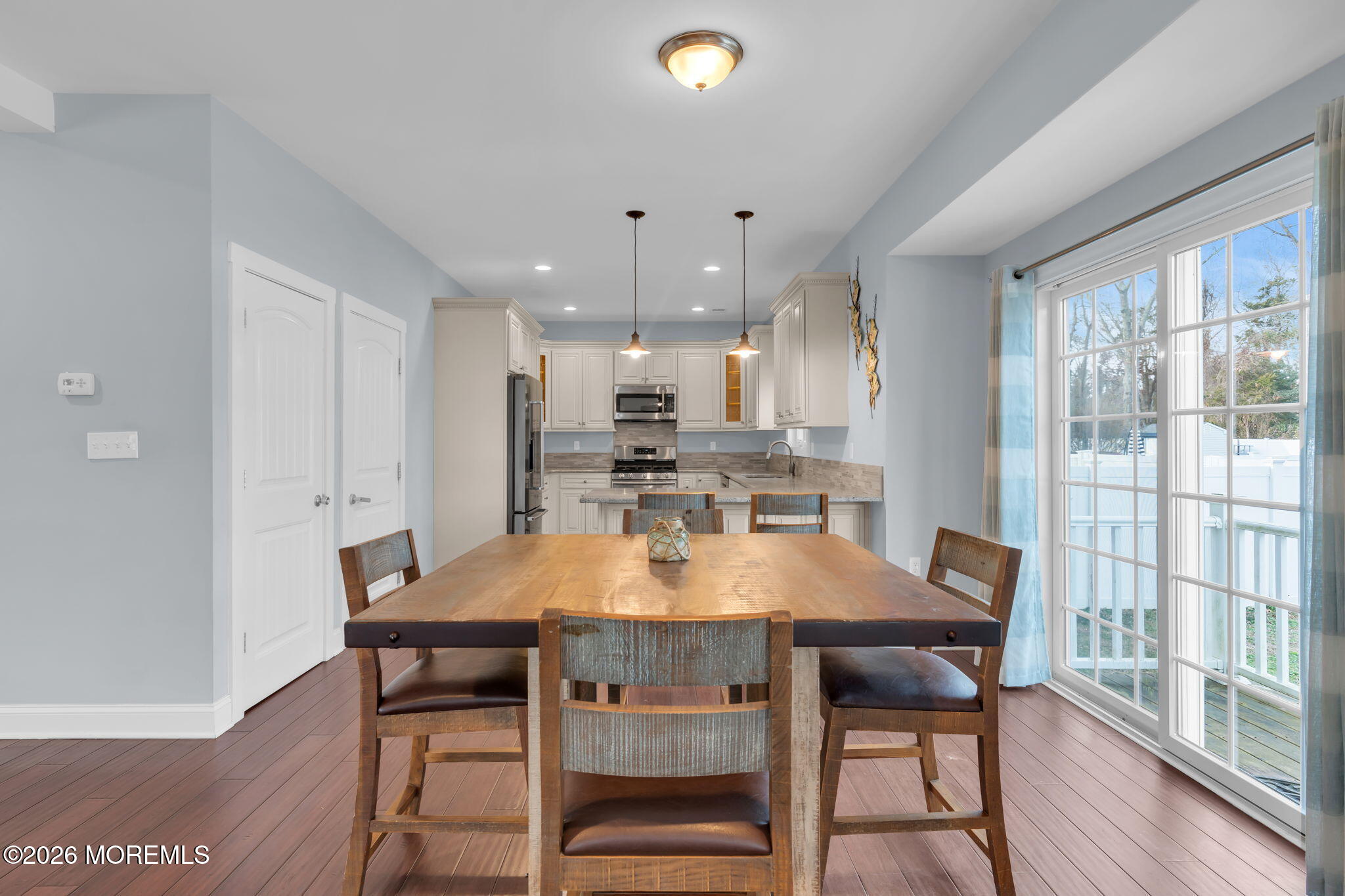 4 Conor Court Bayville, NJ 08721 - Photo 30 of 45 a kitchen with a dining table chairs and wooden floor