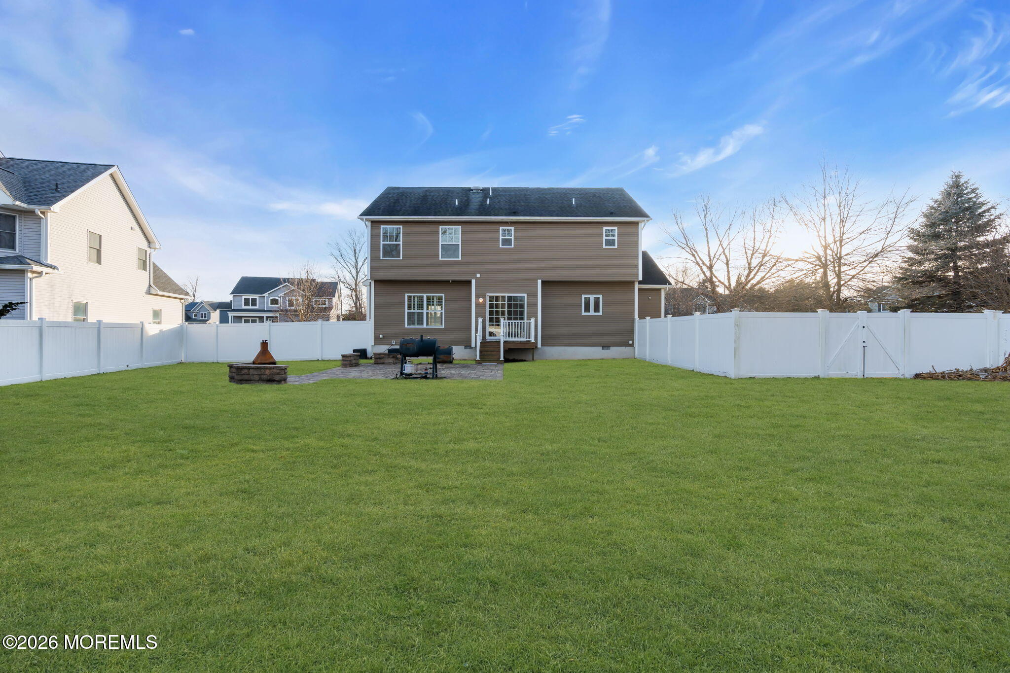 4 Conor Court Bayville, NJ 08721 - Photo 3 of 45 a front view of a house with a garden and plants
