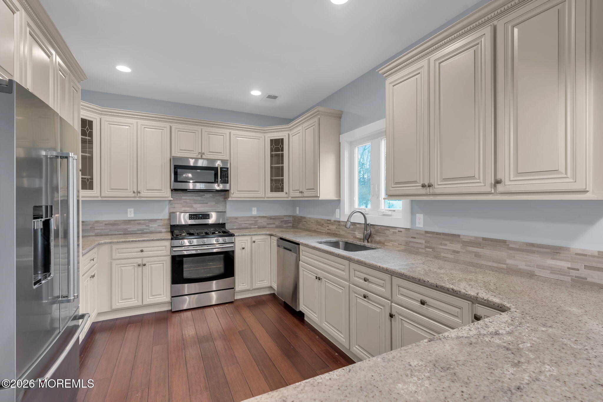 4 Conor Court Bayville, NJ 08721 - Photo 36 of 45 a kitchen with stainless steel appliances granite countertop a stove a sink and white cabinets