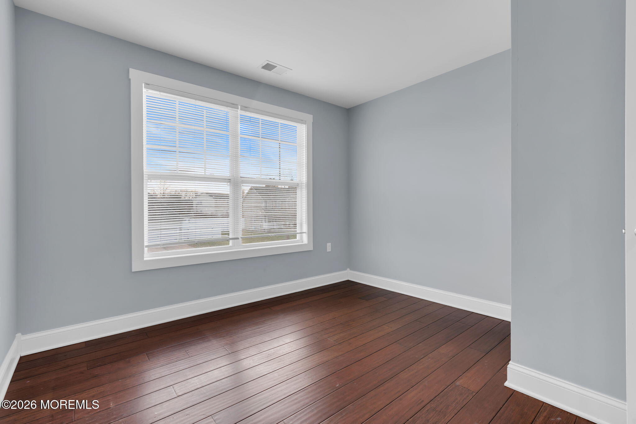 4 Conor Court Bayville, NJ 08721 - Photo 41 of 45 a view of an empty room with wooden floor and a window