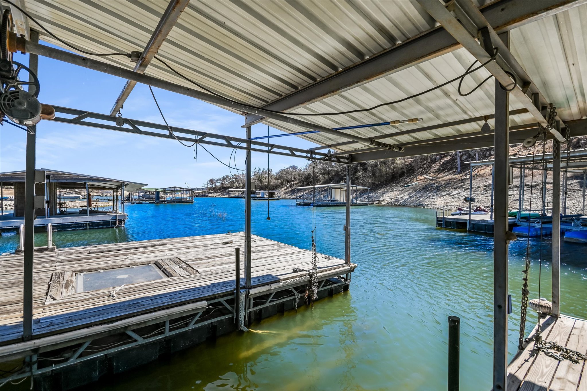 Dock area featuring a water view