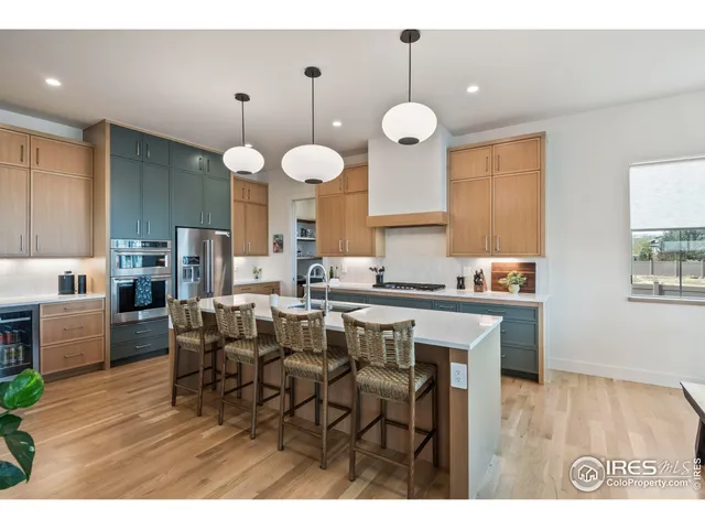 a kitchen with a table and chairs in it