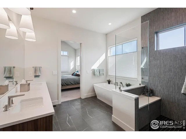 a en suite bathroom with a sink and mirror