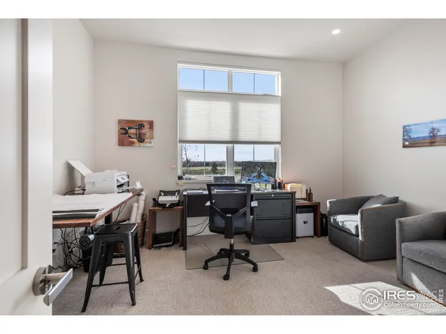 a workspace with furniture and a window