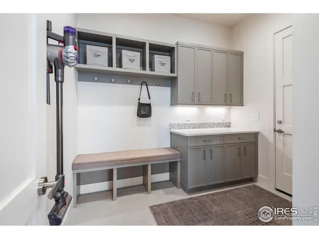 a room with cabinets and wooden floor