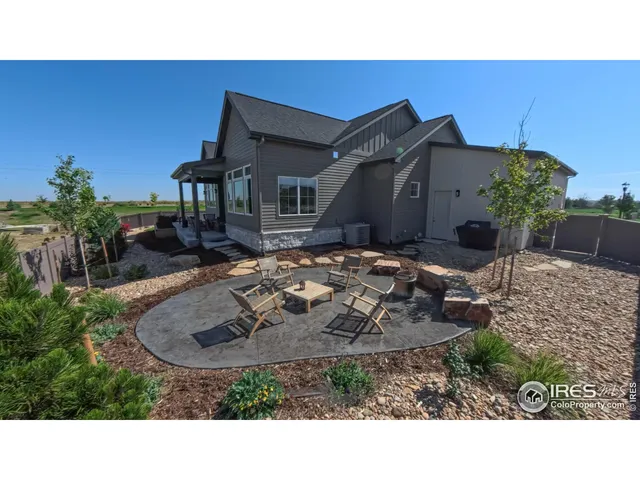a view of a backyard with potted plants