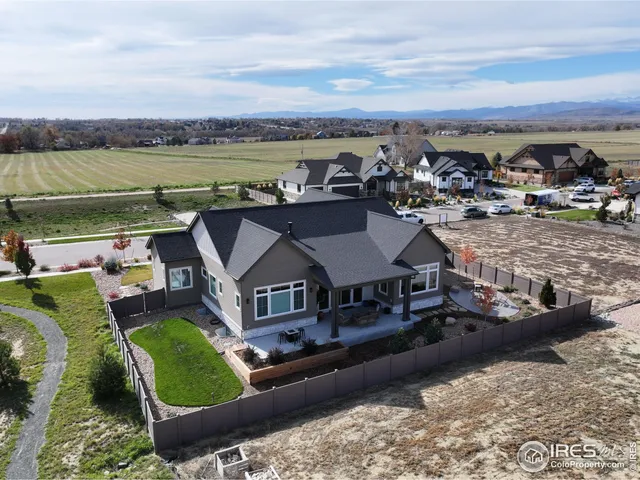 an aerial view of a house with outdoor space